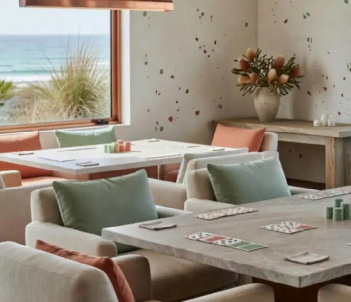 Sunlit venue interior with natural stone, pale timber and card tables prepared for offline poker